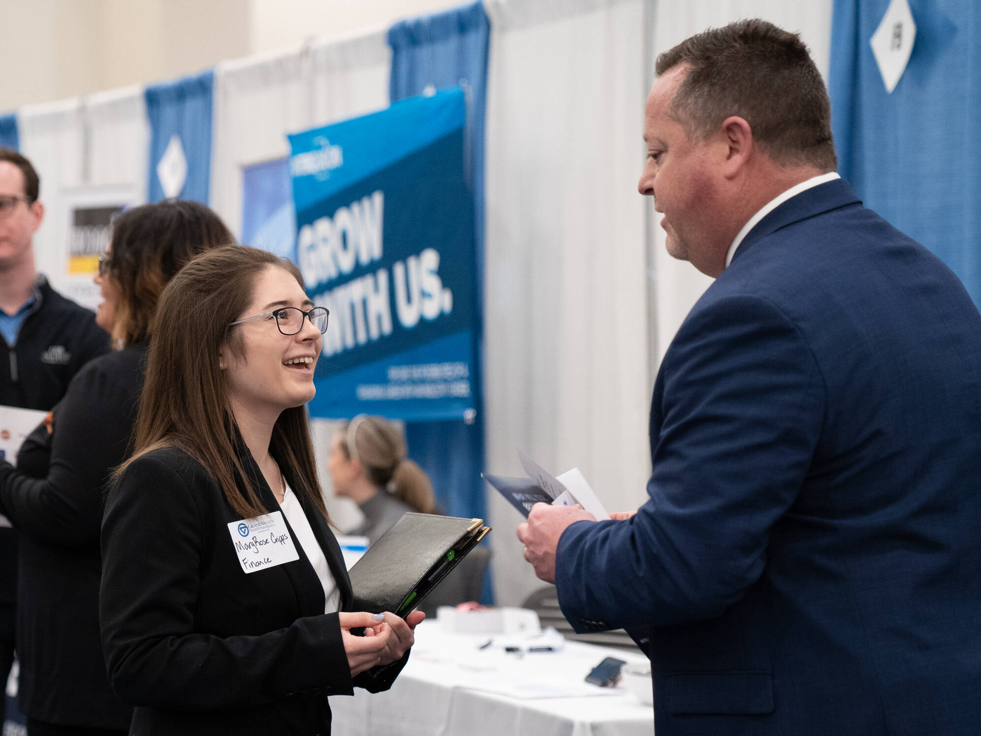 two people networking at the career fair